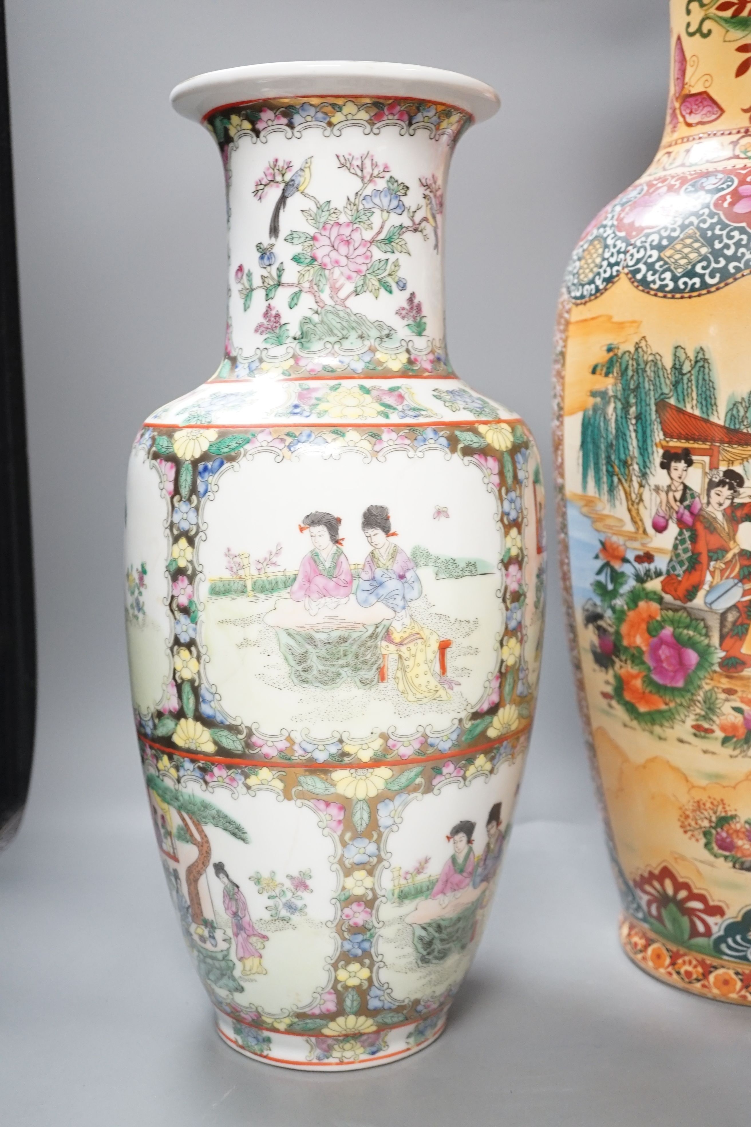 Three 20th century Chinese famille rose vases, tallest 61cm